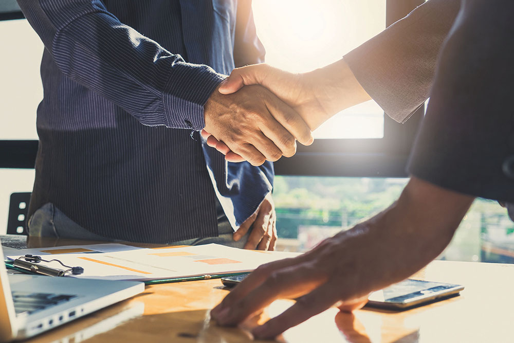 Business partnership meeting concept. Image businessmans handsha